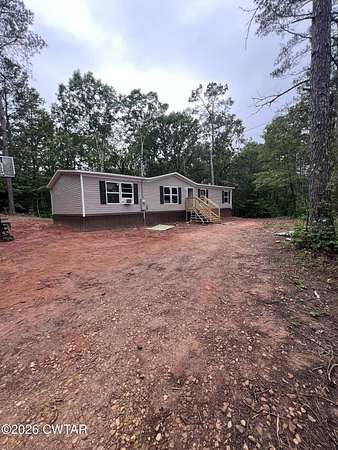 8.84 Acres of Land with Home for Sale in Henderson, Tennessee