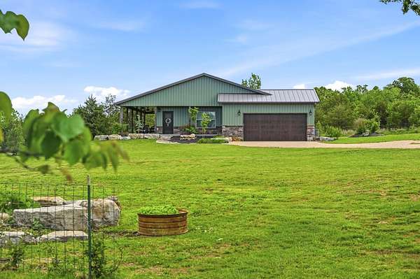50 Acres of Agricultural Land with Home for Sale in Aurora, Missouri