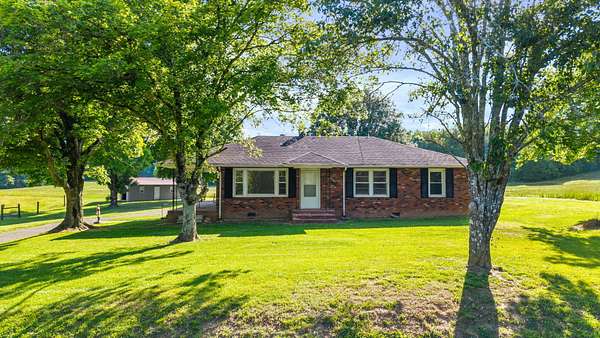 97.8 Acres of Land with Home for Sale in Etowah, Tennessee