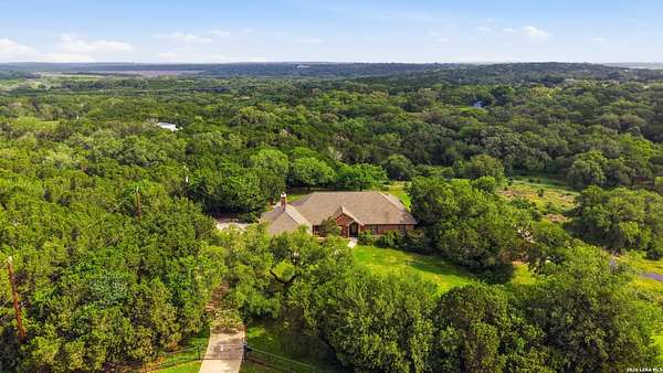 7.68 Acres of Land with Home for Sale in New Braunfels, Texas