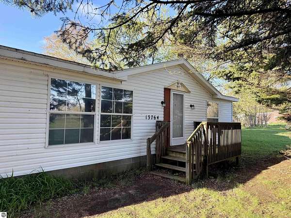 4 Acres of Land with Home for Sale in Kewadin, Michigan