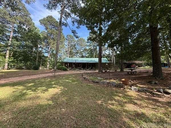 18.4 Acres of Land with Home for Sale in El Dorado, Arkansas