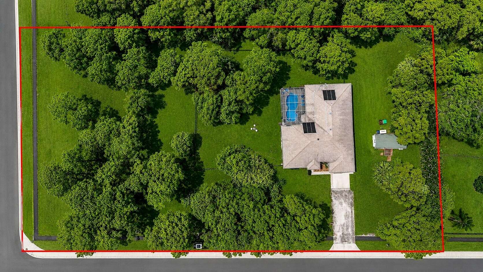 2.39 Acres of Land with Home for Sale in The Acreage, Florida