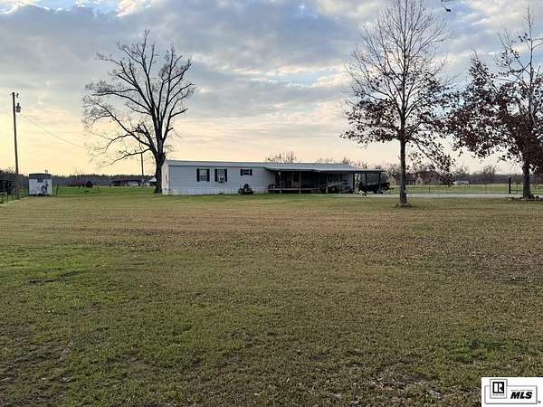 6.79 Acres of Land with Home for Sale in Delhi, Louisiana
