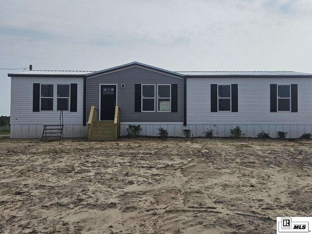 1.55 Acres of Land with Home for Sale in Calhoun, Louisiana