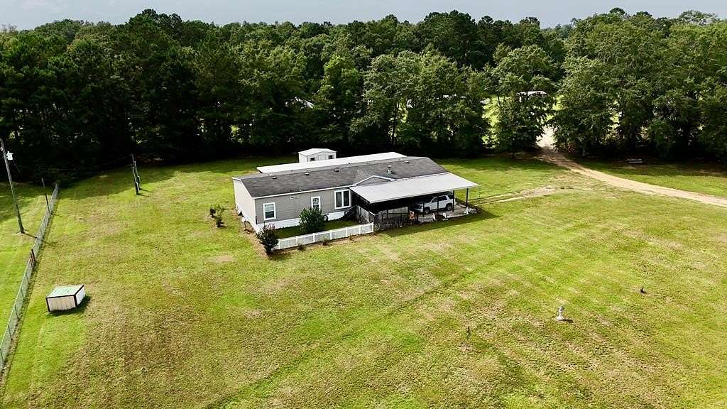 13.6 Acres of Land with Home for Sale in Slocomb, Alabama