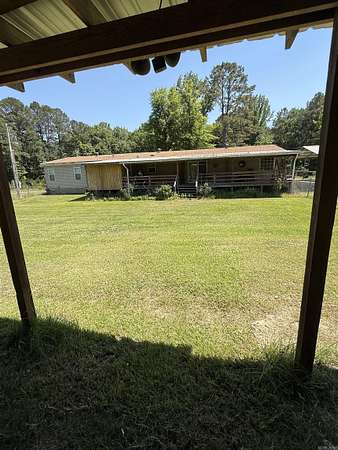 7.52 Acres of Land with Home for Sale in Louann, Arkansas