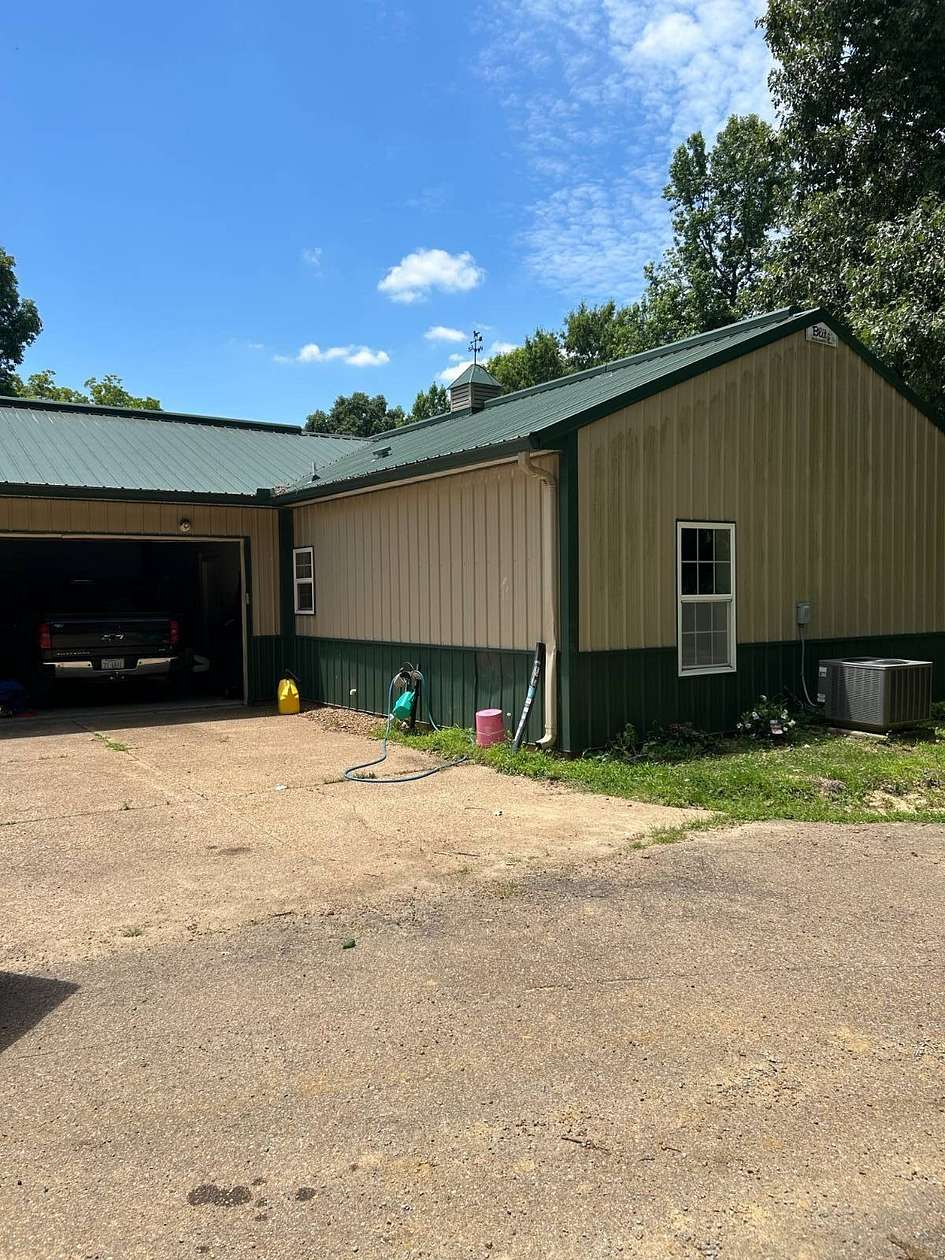 6.9 Acres of Land with Home for Sale in Millington, Tennessee