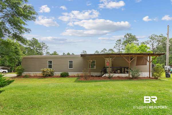 24.2 Acres of Land with Home for Sale in Robertsdale, Alabama
