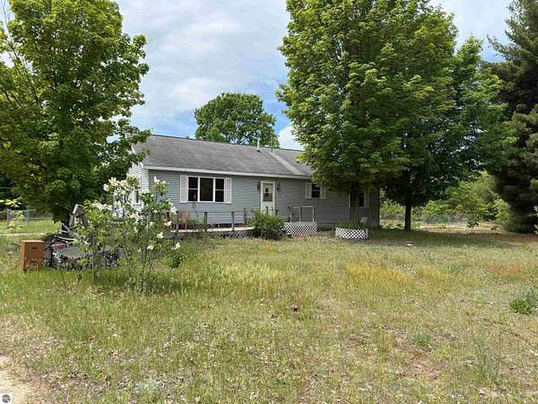 9 Acres of Land with Home for Sale in Interlochen, Michigan