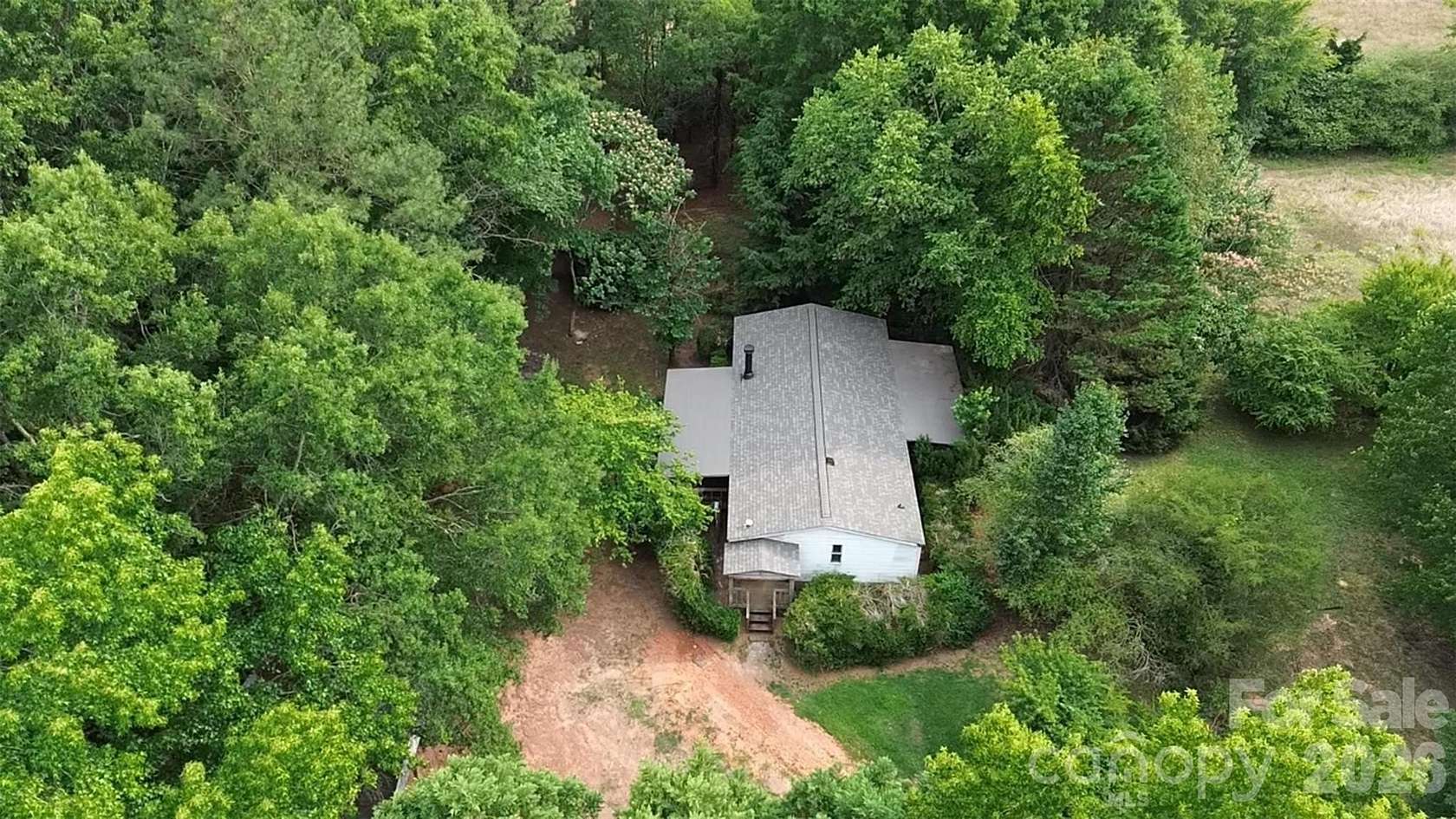 8.18 Acres of Land with Home for Sale in Peachland, North Carolina
