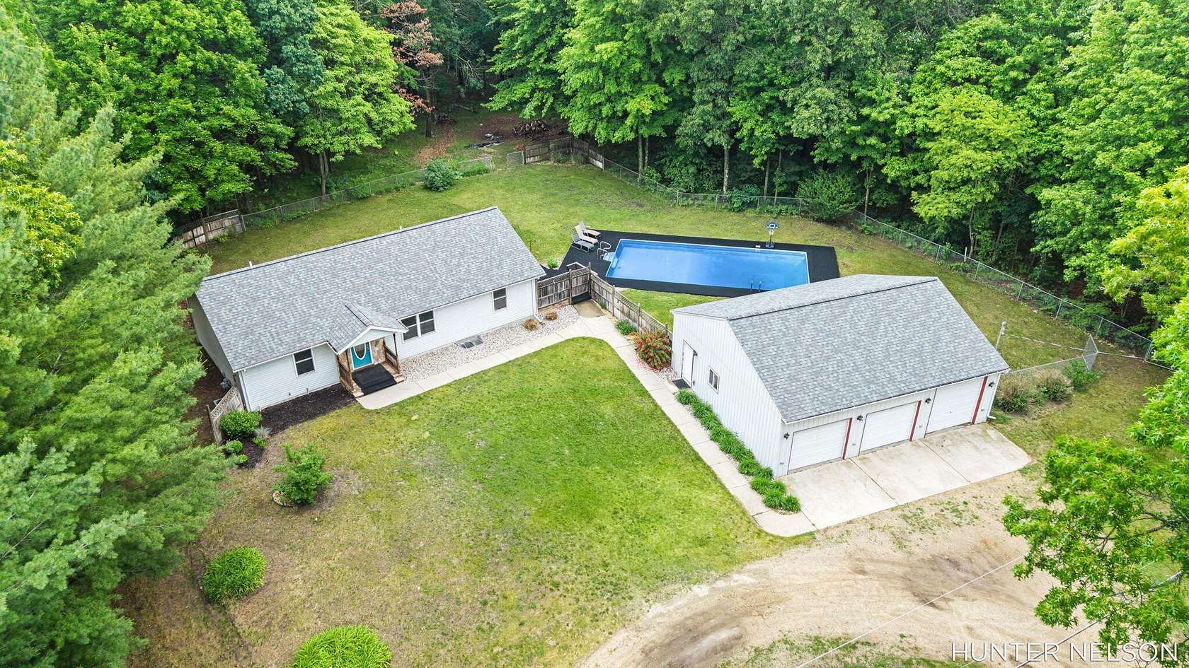5.12 Acres of Land with Home for Sale in Grant, Michigan