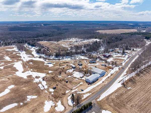 100 Acres of Land with Home for Sale in Ellsworth, Michigan
