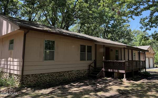 12.4 Acres of Land with Home for Sale in Joplin, Missouri