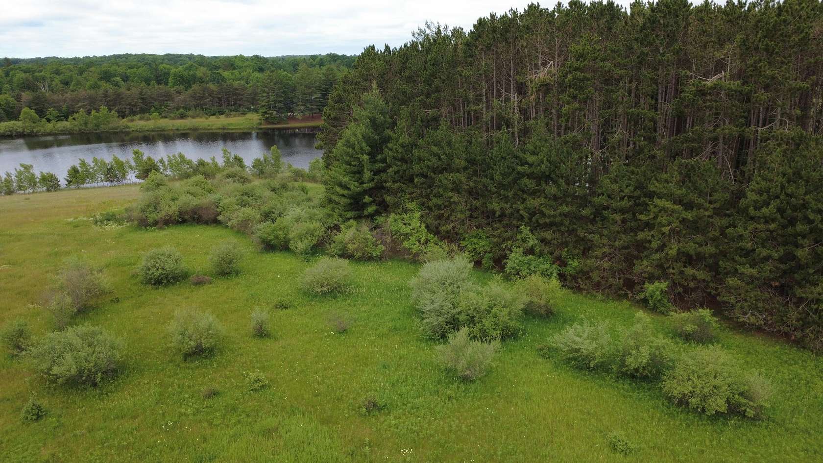 0.77 Acres of Residential Land for Sale in Canadian Lakes, Michigan