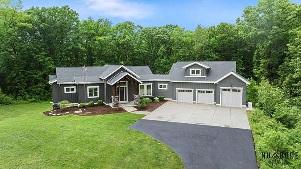 14 Acres of Land with Home for Sale in Comstock Park, Michigan