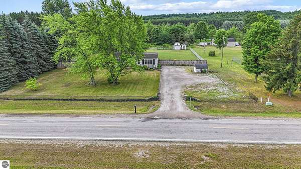 4.88 Acres of Land with Home for Sale in Grawn, Michigan