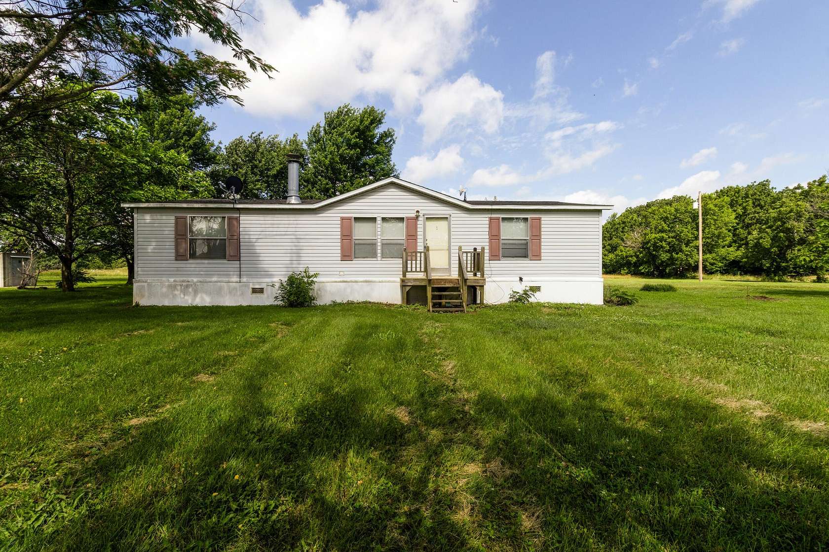4.6 Acres of Land with Home for Sale in Carthage, Missouri