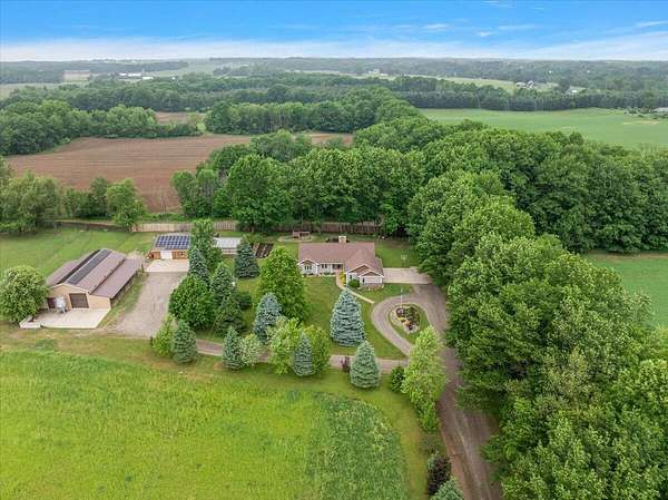 19.2 Acres of Land with Home for Sale in Grant, Michigan