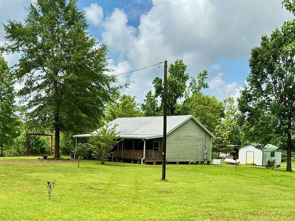 23.7 Acres of Recreational Land with Home for Sale in Douglass, Texas