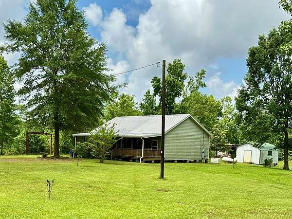 23.7 Acres of Recreational Land with Home for Sale in Douglass, Texas