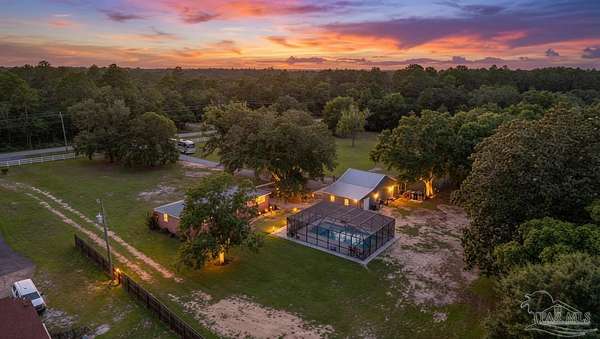 7.6 Acres of Land with Home for Sale in Milton, Florida