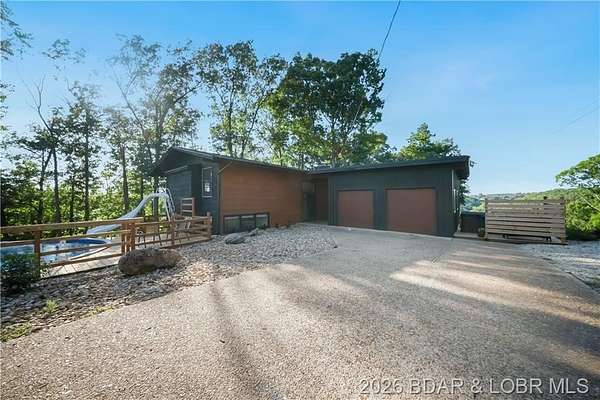 13 Acres of Recreational Land with Home for Sale in Camdenton, Missouri