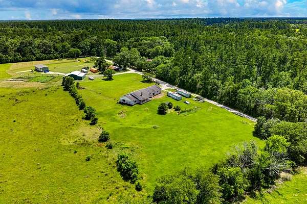 9.84 Acres of Land with Home for Sale in Apple Springs, Texas