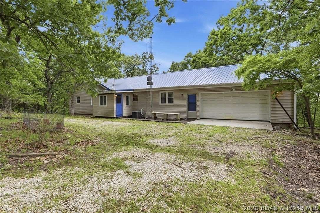 7.2 Acres of Land with Home for Sale in Sunrise Beach, Missouri