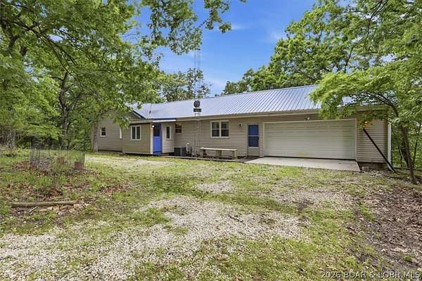 7.2 Acres of Land with Home for Sale in Sunrise Beach, Missouri
