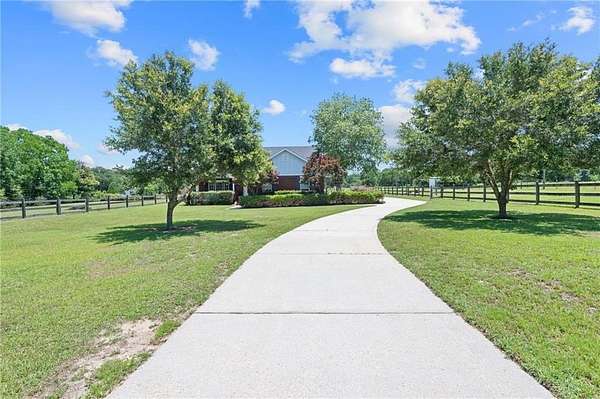 4.87 Acres of Land with Home for Sale in Grand Bay, Alabama