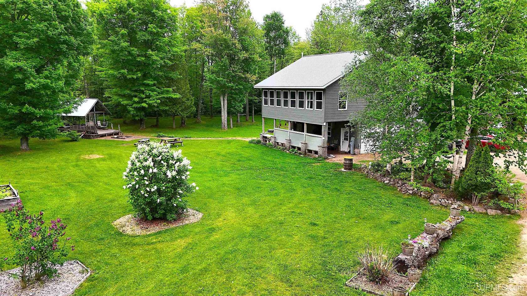 45 Acres of Recreational Land with Home for Sale in Skandia, Michigan
