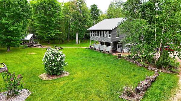 45 Acres of Recreational Land with Home for Sale in Skandia, Michigan