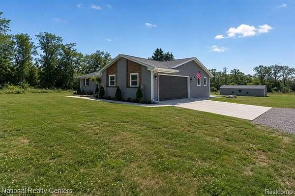 4 Acres of Land with Home for Sale in Highland Township, Michigan