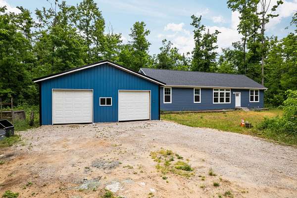 10.1 Acres of Recreational Land with Home for Sale in Elmira, Michigan
