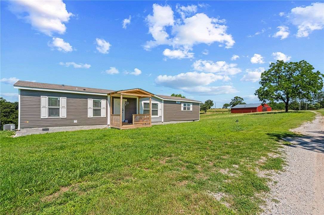 7.3 Acres of Land with Home for Sale in Omaha, Arkansas