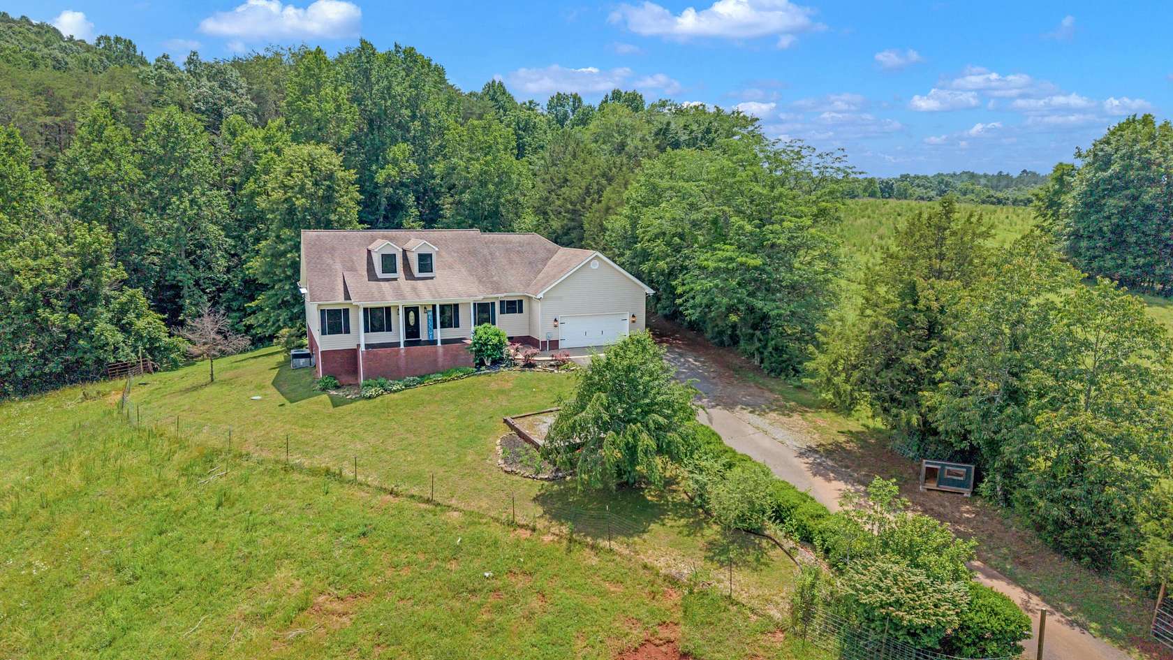 13.8 Acres of Land with Home for Sale in Riceville, Tennessee