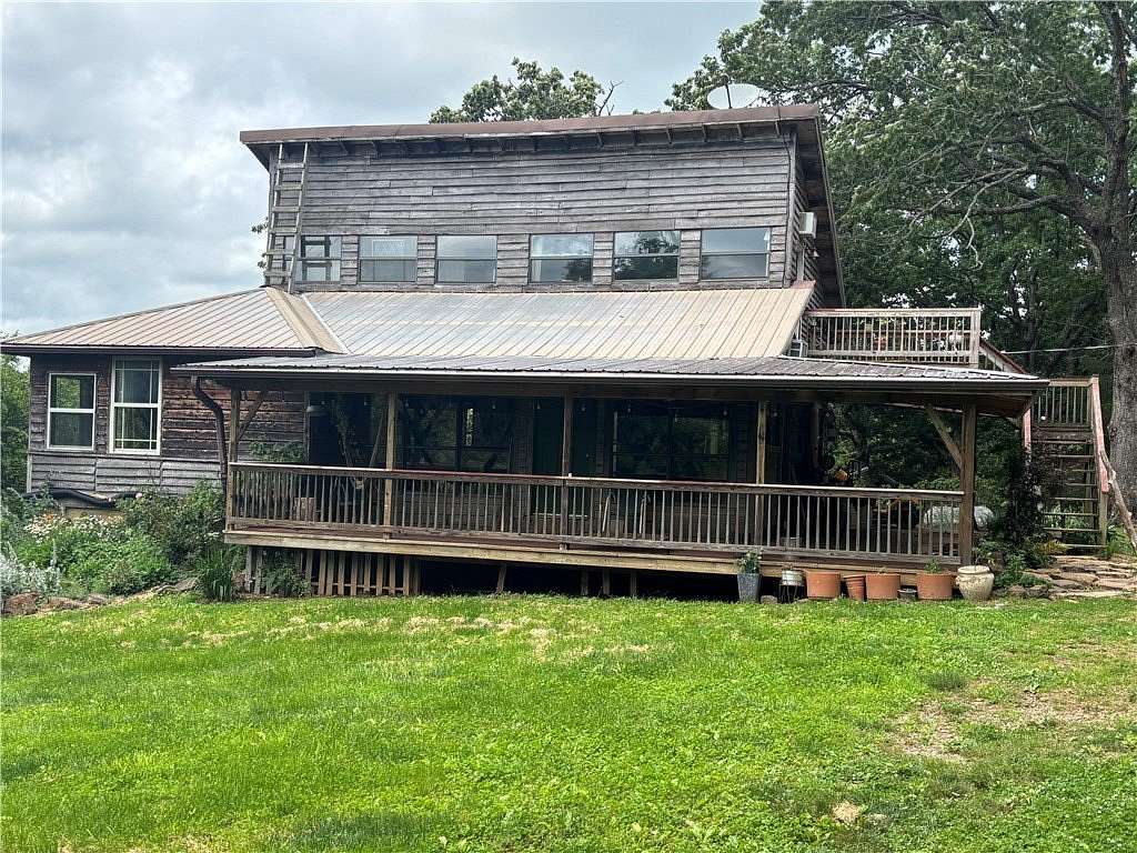 40 Acres of Land with Home for Sale in Pettigrew, Arkansas
