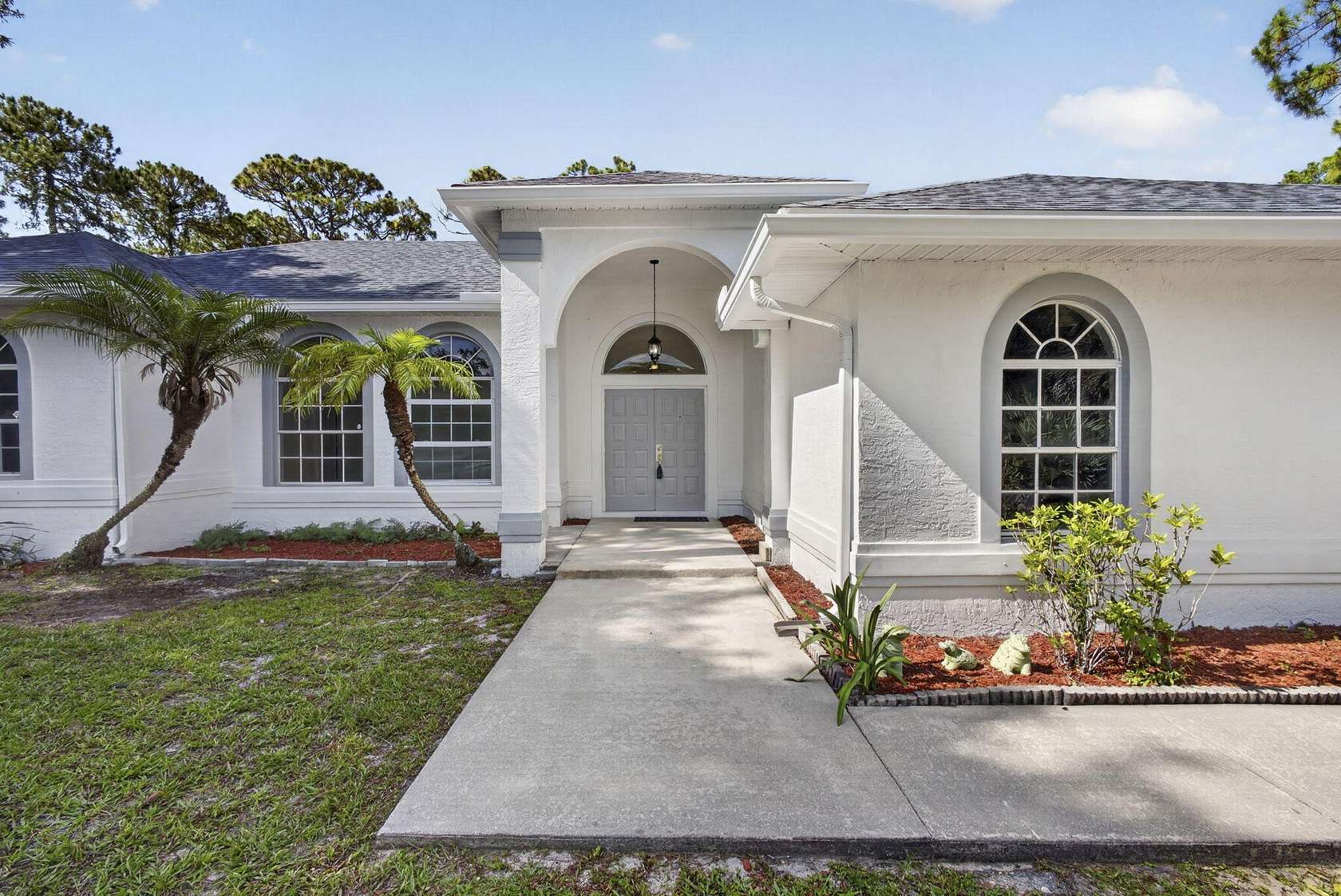 1.53 Acres of Land with Home for Sale in The Acreage, Florida