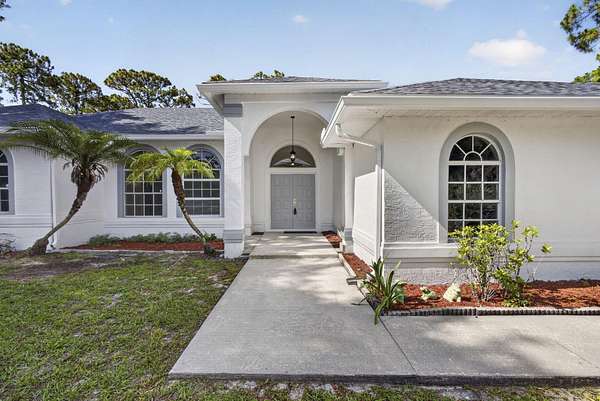 1.53 Acres of Land with Home for Sale in The Acreage, Florida