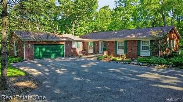 2.5 Acres of Land with Home for Sale in Groveland Township, Michigan