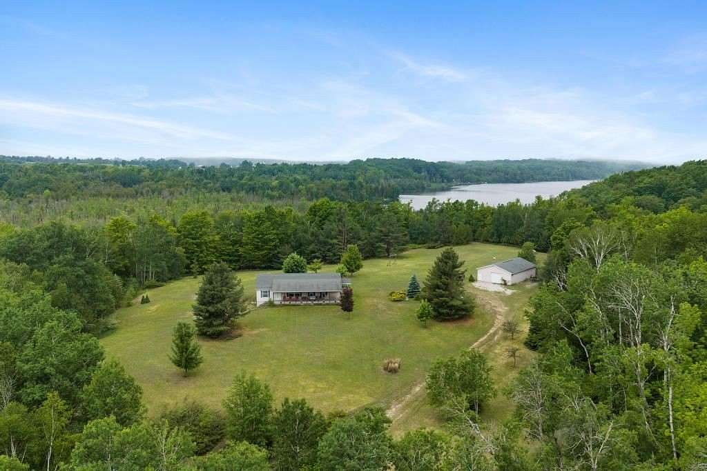 75 Acres of Land with Home for Sale in Charlevoix, Michigan