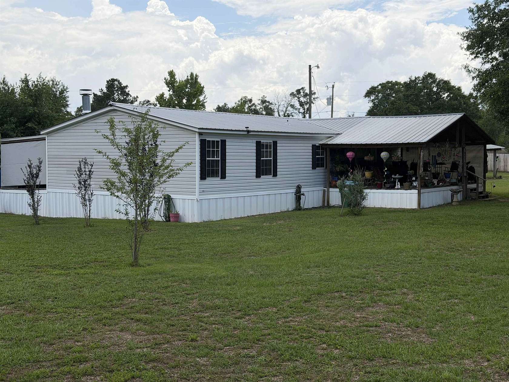 1.7 Acres of Land with Home for Sale in Sneads, Florida