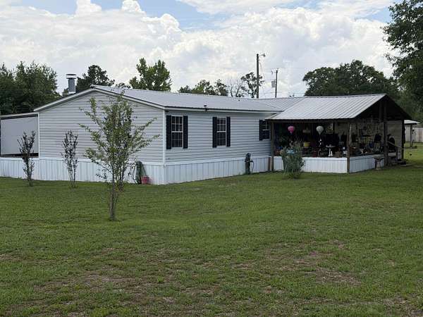 1.7 Acres of Land with Home for Sale in Sneads, Florida