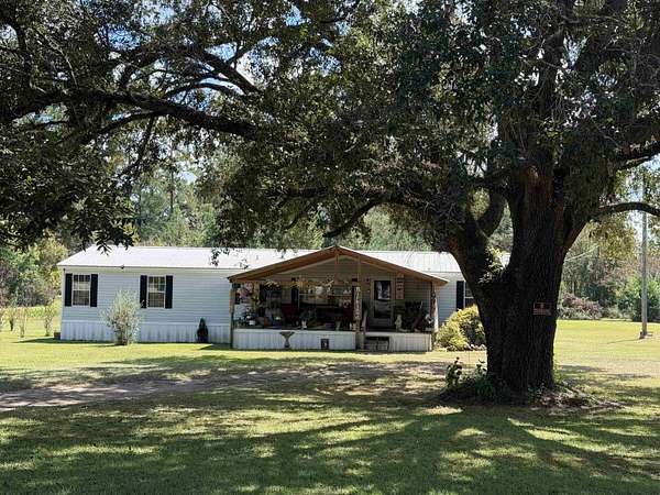 1.7 Acres of Land with Home for Sale in Sneads, Florida
