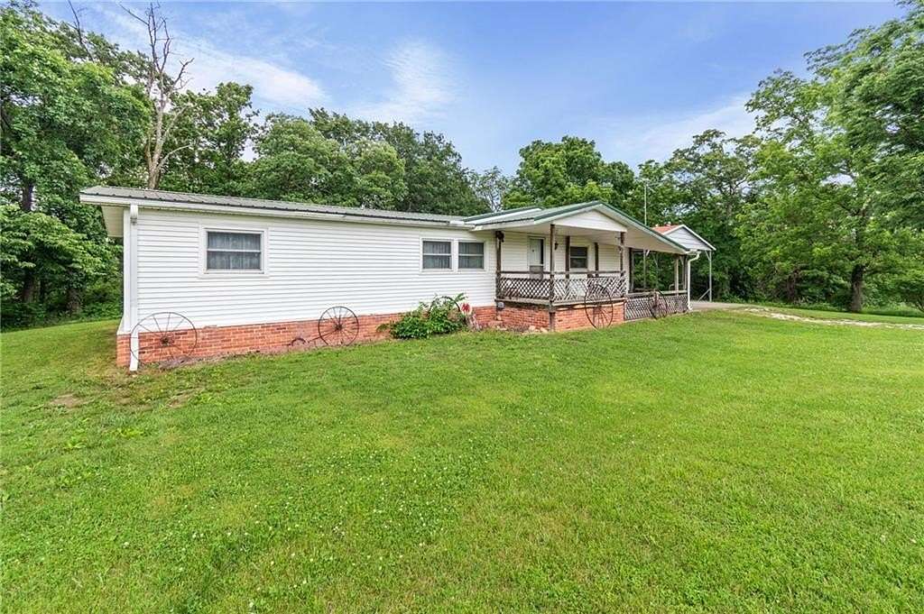 42 Acres of Recreational Land with Home for Sale in Lawson, Missouri