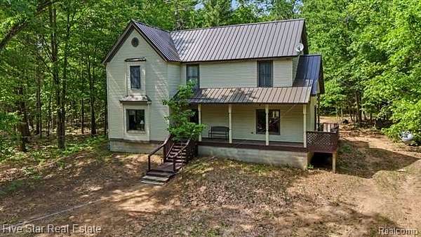 10 Acres of Recreational Land with Home for Sale in Clayton Township, Michigan