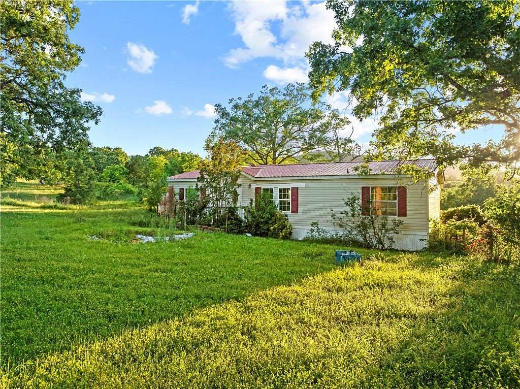 6.15 Acres of Land with Home for Sale in Peel, Arkansas