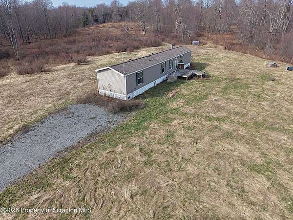 8.1 Acres of Land with Home for Sale in Thompson, Pennsylvania