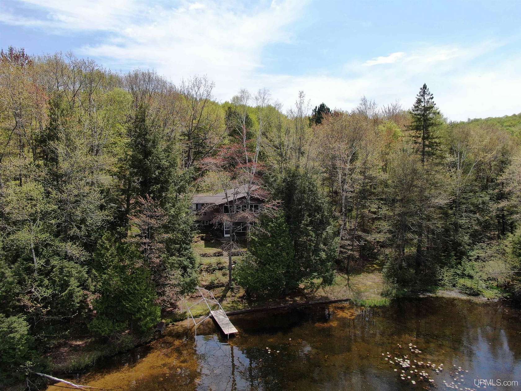 23.2 Acres of Recreational Land with Home for Sale in Skandia, Michigan